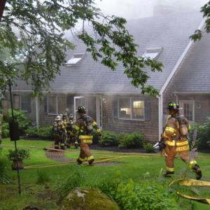 Firefighters from Camden, Hope, Lincolnville, Rockport and Union rushed to a fire that structurally damaged an oceanfront home in Camden July 6. (Photos by Lynda Clancy)