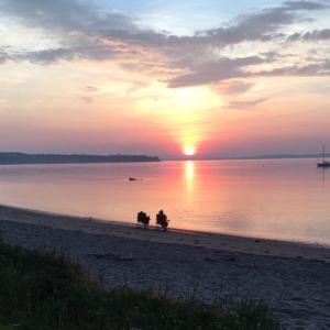 A couple watch the sunrise over Lincolnville Beach, perhaps dreaming of one day moving north from wherever they live to our beautiful corner of the world.
Photo by Diane O’Brien beach