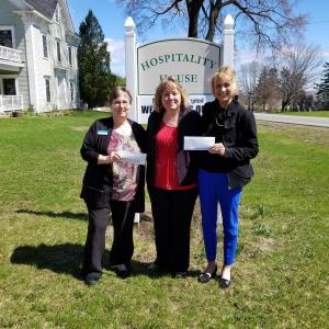 Kim Milton, retail lending assistant (left) and Pam Kenniston, senior retail loan officer (right) present Kim Rand, operations and development coordinator at KCHC. (Photo courtesy Knox County Homeless Coalition)
