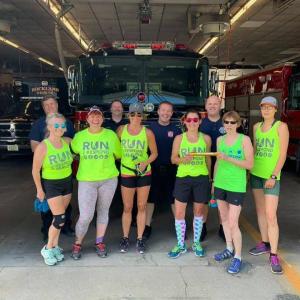 Stage 14 transition point at the Rockland Fire Station. Front row, L-R: Mary Smith, Doug Johnstone, Beth Wilkas Feraco, Jala Tooley, Theresa Withee, and Frances Killea. Back row: Asst. Fire Chief Adam Miceli, Firefighter Rusty Barnard, Firefighter Max Negley, and Lt. Patrick Lowe. (Photo courtesy Run2Respond)
