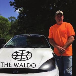Waldoboro Selectman Abden Simmons with the car he will be racing Aug. 24.