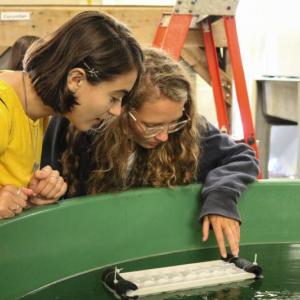 First-year students observe lobster larvae at the Department of Marine Resources as part of UMaine’s marine science boot camp. (Photo courtesy University of Maine Darling Marine Center)