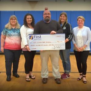 Representatives from the Town of Hope, Hope Elementary School and First National Bank pose for a photo at a check presenting ceremony. Pictured from left are Samantha Mank, Chelsea Summers, Jake Miller, Danielle Fagonde and Niki Janczura. (Photo by Molly Cole)