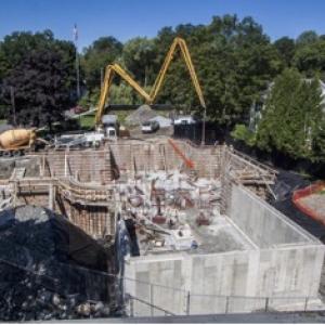 This is a photo taken by Tom Young presumably from his roof or upper window that shows the foundation to date with the most recent pour taking place. (Photo courtesy Rick Bates)