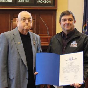 Senate President Troy Jackson (right) acknowledges Cushing resident Arthur Kiskila for his service to the community. (Photo courtesy Scott Reed)
