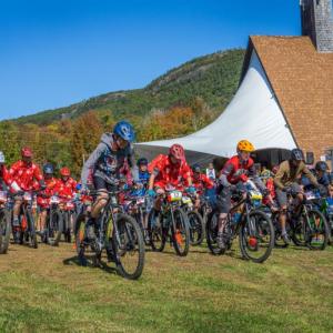 Mountain bikers burst from the starting line during the 6th annual Camden Snow Bowl Trail Fest. (Photo by Michael O’Neil)