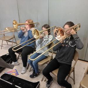 Two donated trombones make their first notes playing Hot Cross Buns in Prescott Memorial School’s beginner band. (Photo courtesy Megan Rogers)