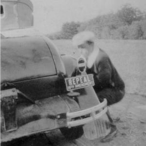 Ivan Young changing a tire on his Model T. Notice the early version of a bumper sticker.
photo courtesy of Lincolnville Historical Society repeal