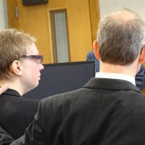 Attorney Chris MacLean comforts Sharon Carrillo during opening statements Dec. 8. (photo by Erica Thoms)