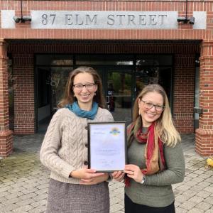UMC staff Megan Williams and Kelly Carey display the 2019 Top-Rated Award. (Photo courtesy UMC)