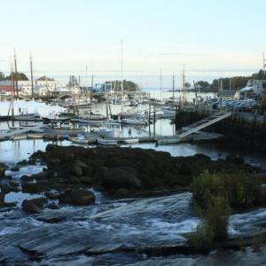 A late autumn view over the waterfall from Megunticook River flowing into Camden Harbor. (Photo courtesy Lauren Caffe)