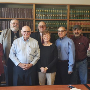Margaret Jones, Mountainside Community Cooperative board vice president; Richard Leach, board president; Stuart Welch and Margaret Welch, seller; Paul Harding, board secretary; Phil Amoroso, board treasurer; Jeff Jolicoeur, board operations manager; and Ron Stasiowski, board director, at large. (Photo courtesy Mountainside Community Cooperative)