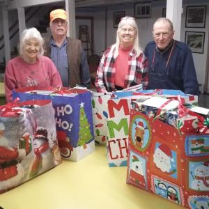 Post 30 volunteers who wrapped holiday presents for veterans at the Maine Veterans’ Home in Augusta are from left, Judy and Norman Carver, Connie Sukeforth, and Geof Chapman. Absent from the photo is Jeff Sukeforth who was the photographer. (Photo courtesy of Jeff Sukeforth)