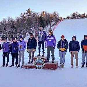 Camden Hills skiers Oscar Horovitz (far left) and Devon Smith (far right) at the podium Feb. 8. (Courtesy Mike Smith)