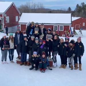 On center podium, in back, are Camden Snow Bowl skiers Greer Lafiura, Zola Roberts and Lily Stowe. Next row includes Ula Durow, Grace Decubellis, Piper Urey, Maggie Metzler, Katie Grace. Front row includes Estelle Chase and Olive Walker. (Courtesy Weber Roberts)