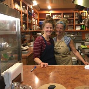 Lindsay Crawford and Mary Smith on task in the co-op kitchen.