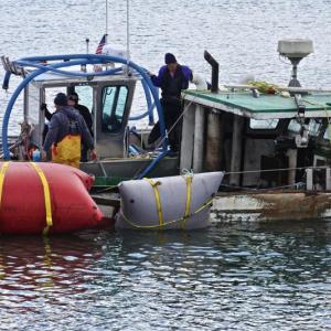 The lobster boat is lifted with inflatable cushions. (Photo courtesy Steve Cartwright)