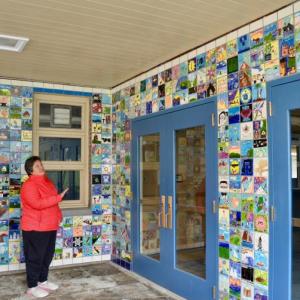 Maria Lib by, Camden-Rockport school superintendent, stands in the entry way to the Camden-Rockport Middle School, May 10. The school, scheduled for demolition in early June, is adorned with hand-crafted tiles made by students in art class over the past 20 years. The tiles are not to be saved; however, photos have been taken of each one, individually, and Libby said the hope is to present them in a new form, somewhere on the middle school’s Knowlton Street campus, which includes a new school and the Mary E. Taylor building. (Photos by Lynda Clancy)