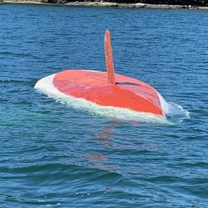 Capsized sailboat belonging to Waldoboro man who was rescued in Friendship today. (Photo courtesy of US Coast Guard)