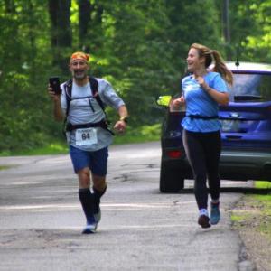 Abigail Nathan, right, and her father Jeff running a graduation day half-marathon. (Courtesy Ellen Curtis)