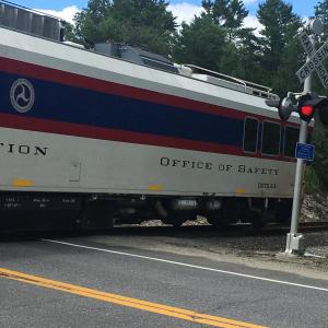 A southbound Federal Railroad Administration car crosses Route 144 in Wiscasset July 15. Courtesy of Gordon and Lynne Kontrath