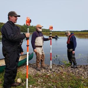 Quantabacook Lake dam, Searsmont. (left to right) Scott Craig, fisheries biologist U.S. Fish & Wildlife Service, Terry Young, President of Georges River T.U., and Mark Pasterczyk of ME Dept. of Marine Resources. (Steve Hirshberg photo)