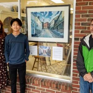Christine Buckley, owner of Christine's Gallery, son and West Bay Satellite chair JP Fecteau with painting by J.R. Braugh