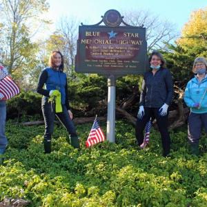 From left to right, Camden Garden Club members Karen Cease, Jennifer Gromada, Cindy Grondahl, and Vicki Mast beautify the Blue Star Memorial ahead of Veterans Day. (Photo courtesy Camden Garden Club)