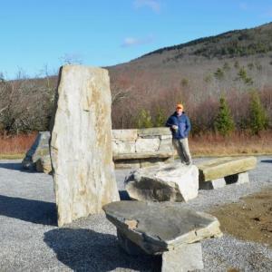 Coastal Mountains Land Trust Executive Director Ian Stewart, standing in the stone seating area built by Stonescape Masonry, at the Thorndike Brook Trailhead, on Hope Street. (Photo by Lynda Clancy)