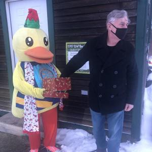 Club President Ken Gardiner draws the winning ticket. (Photo courtesy West Bay Rotary)