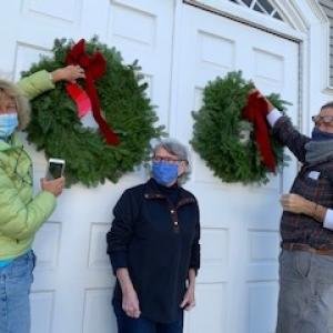 Denise Munger, Gail Nicholson, and Doug Cole dress up the Rockport Opera House. (Photo courtesy Rockport Garden Club)