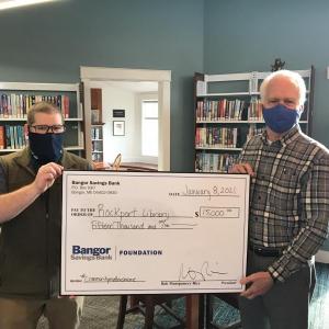 On hand to accept a $15,000 award from the Bangor Savings Bank Foundation are Rockport Public Library Director Ben Blackmon (left) and RLF Vice President John Viehman. (Photo by Keith Drago)