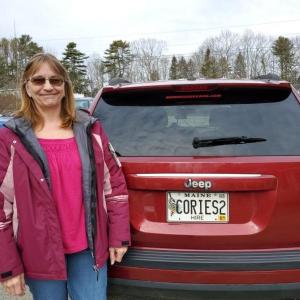 Corinna Whitehill by one of her Corie’s Rides cabs. Photo courtesy Corinna Whitehill