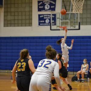 Boothbay Region senior Glory Blethen launches a 3-pointer Feb. 15 against Medomak Valley. The basket turned into her 1,000th career point. BILL PEARSON/Boothbay Register