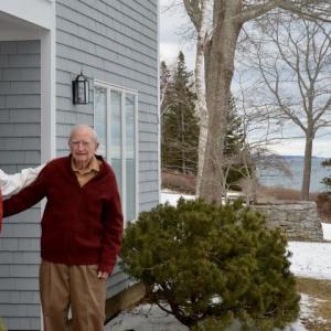 Allen Mitchell and Howard Miller stand outside the house that McCormick Associates built for Miller and his wife in 1985. On Feb. 4, 2021, the home stood firm, as did Miller, at age 100, on the shores of Rockport.