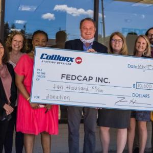 Flanking CoWorx Staffing Services CEO Tim Hartnett during the recent check presentation, are (from left to right): Brian Cummings, Fedcap Placement Specialist; Amy Whipple, CoWorx Sr. Branch Manager; Barbara Shannon, CoWorx Sr. Director Sales & Operations; Sianeh Omeze, Fedcap Program Manager; Serena M. Powell, Fedcap Executive Director; Shannon Emery, Fedcap AVP Programs and Services; Tony Baker, Fedcap Program Manager; Katie Shellene, Fedcap Placement Specialist; and Raissa Kaze, CoWorx Field Recruiter. (Photo courtesy CoWorx Staffing Services)
