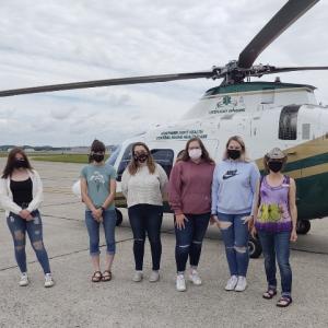 CNA students from Waldo County Technical Center explore a LifeFlight of Maine helicopter. L to R: Meagan DeMerchant, Macy Fowler, Tisha Stoltz, Helena Staples, Chloe Staples, and CNA program instructor Frannie Conlon. (Photo courtesy Waldo County Technical Center)