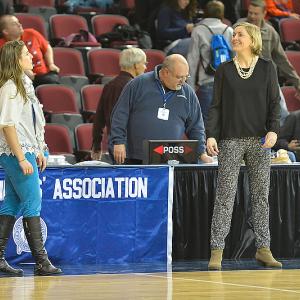 Samantha (Wiley) Bragg, then the head coach of the Oceanside girls basketball team, stands at left having a laugh with fellow Camden Hills alumna Meg Cressler during a tournament game at the Cross Center in Bangor. (File photo/Ron Hawkes)