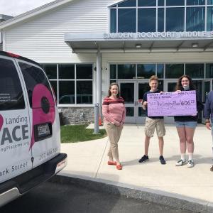 L-R: Becca Gildred, development director for Knox County Homeless Coalition; Walker Hedrich and Lindsey Clifford, 8th graders at CRMS; and Joseph Hufnagel, director of The Landing Place youth program. (Photo courtesy Knox County Homeless Coalition)