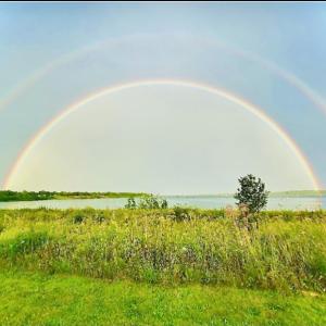 “Double Rainbow over Rockland, Maine Harbor” by Nadia Kirkham. (Photo courtesy Cricket Magazine)