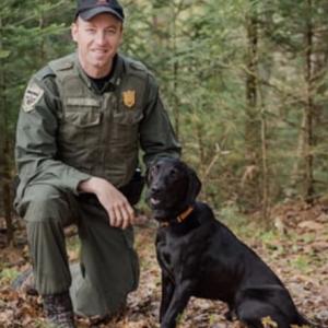 Game Warden Chad Roberston and K9 Storm. (Photo courtesy Maine Warden Service)