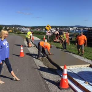 In September 2021, City Council and Harbor Trail Committee member Louise MacLellan-Ruf watches as Public Works employees build a section of stamped concrete. L to R: Josh Bodman, Damen Henderson, Ryan Fisher and Chris Donlin. (Courtesy photo)