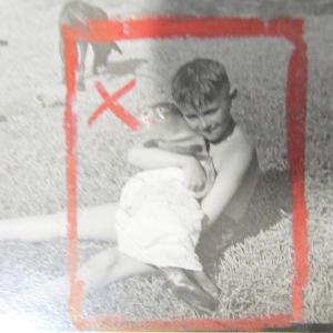 A photograph of a photograph originally taken by reporter Jim Moore of a boy in Rockland who found a baby seal on the beach on June 10, 1953. Photo by Kay Stephens