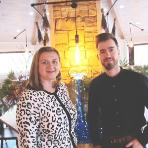 Oana Manton, co-owner with Manager John Sullivan in the warm dining space. Photo by Kay Stephens