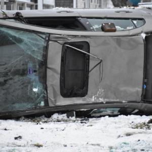 A vehicle lands on its side on a front lawn in St. George, Dec. 28, 2021. (Photo by Sarah Thompson)