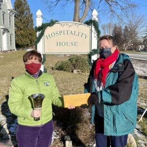 Amy Rollins, concert organizer, presents the donation check to Stephanie Primm, executive director of the Knox County Homeless Coalition. (Photo courtesy Amy Rollins)
