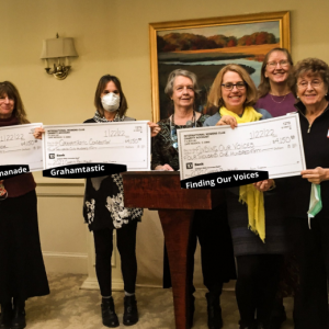 Finding Our Voices’ Patrisha McLean and Mary Lou Smith (front row, right), with Mariene Dargan, president of the International Women’s Club of New England, and directors of the three other charities helping women and children in New England to be so honored. (Photo courtesy Finding Our Voices)