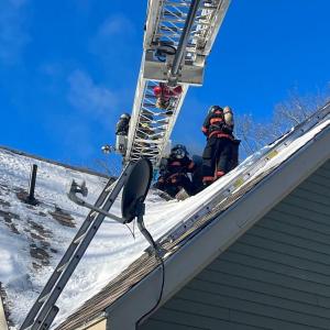 On Jan. 31, the Rockport Fire Department responded to its first chimney fire in 2022. Rockport firefighters could not reach the chimney by using the department’s regular ladders due to the home’s sloping roof design, so the Camden Fire Department provided mutual aid with its ladder truck. (Photo courtesy Rockport Fire Department)