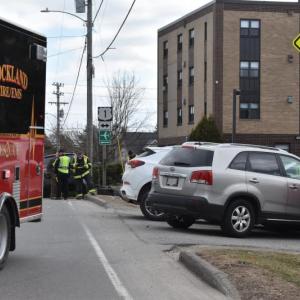 Despite all vehicles coming to a stop on the side of Broadway, Rockland firefighters had to sweep debris, including pieces of tire, from the middle of the road. (Photo by Sarah Thompson)