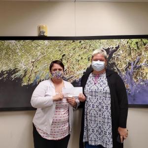 From left to right: Brandy Perkins from the Maine Lobster Festival presents donation to Pope Memorial Humane Society Development Director Chrys DeLorimier. (Photo courtesy Maine Lobster Festival)